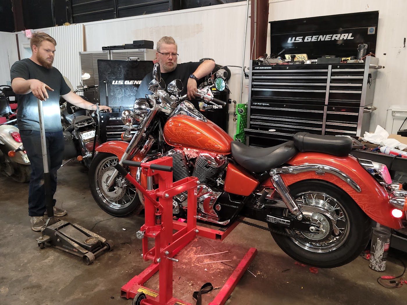 Technicians working on a motorcycle
